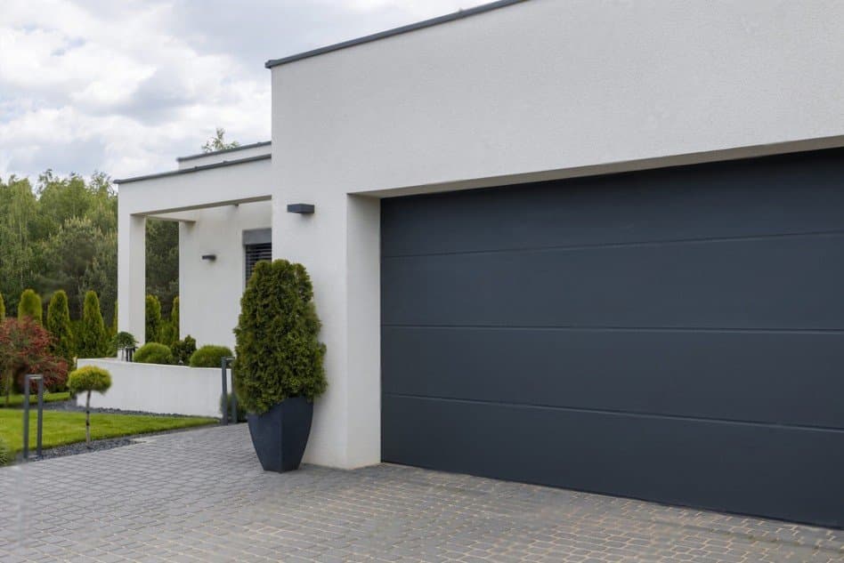 Anthracite sectional garage door on a modern family house